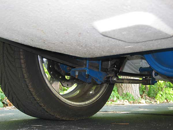 composite single-leaf springs and traction bars