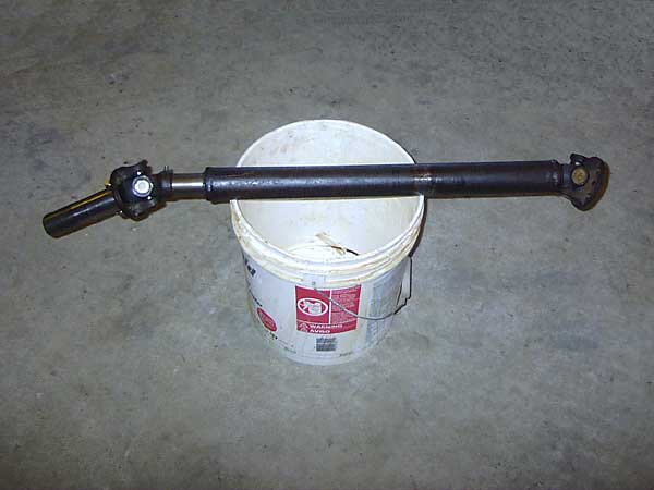 Stock MGB driveshaft, with an adapter to mate to the new transmission