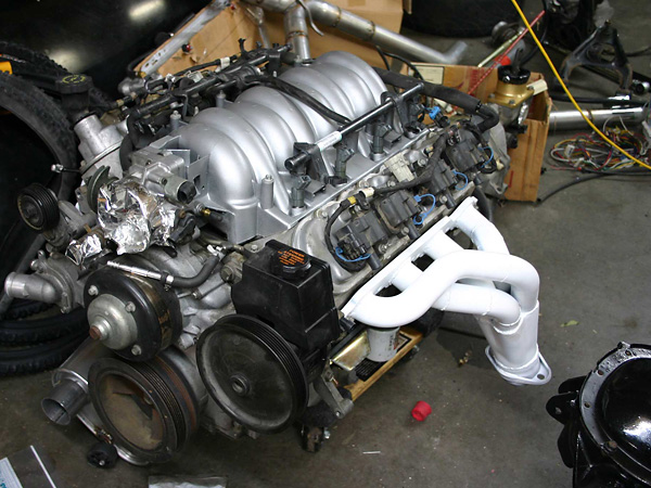 Engine ready for installation, with custom headers installed and painted.