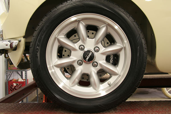 Panasport Racing 8-spoke wheels with Bridgestone Potenza S-03 225/50ZR16 tires.