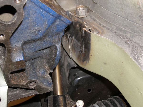 The Ford oil pump mounting boss conflicts with MGB's motor mount.