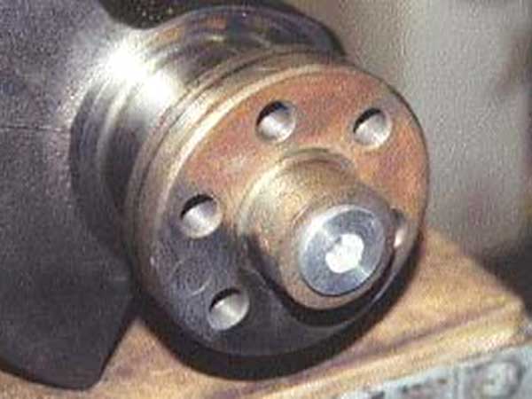 Aluminum lathe adapter positioned in pilot bearing bore