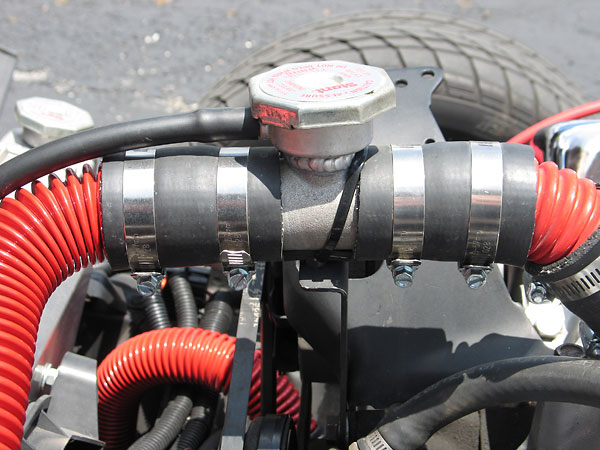 Coolant filler neck and pressure cap.